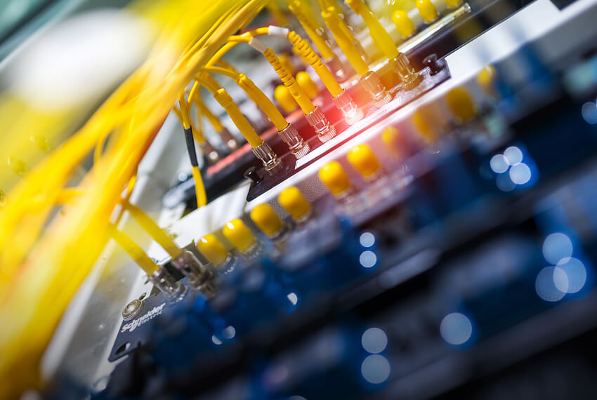 What equipment does fiber optic communication include?